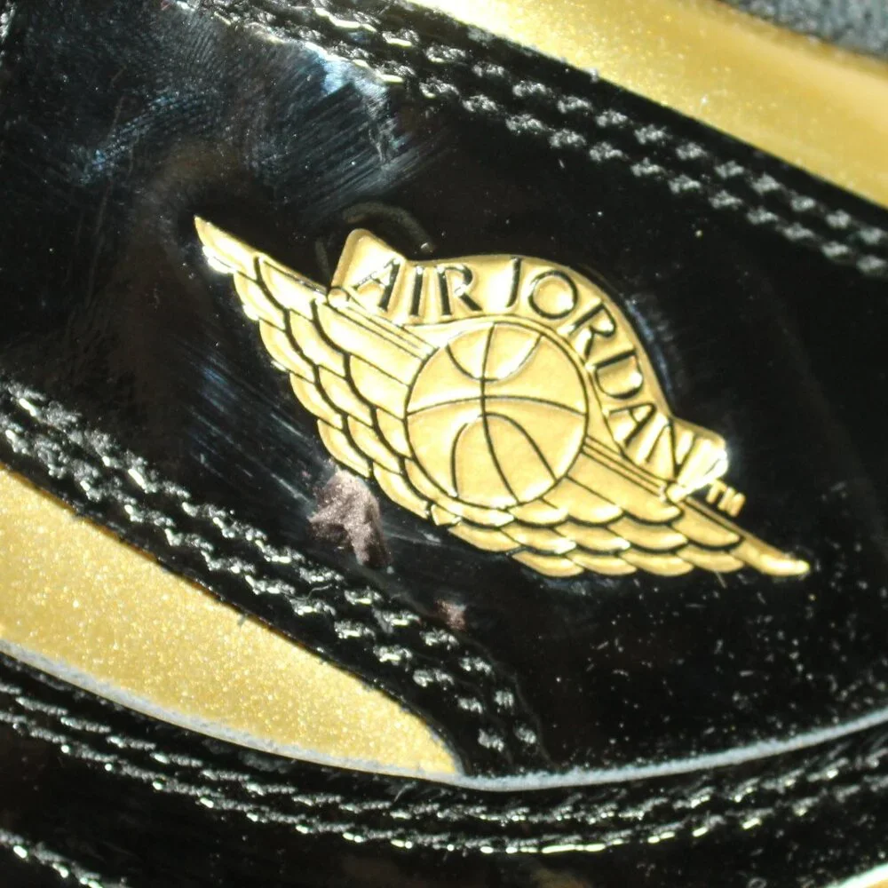 New IOB Jordan Boy's Size 6.5Y/ Women's 8 Black Patent Gold High Top Sneakers